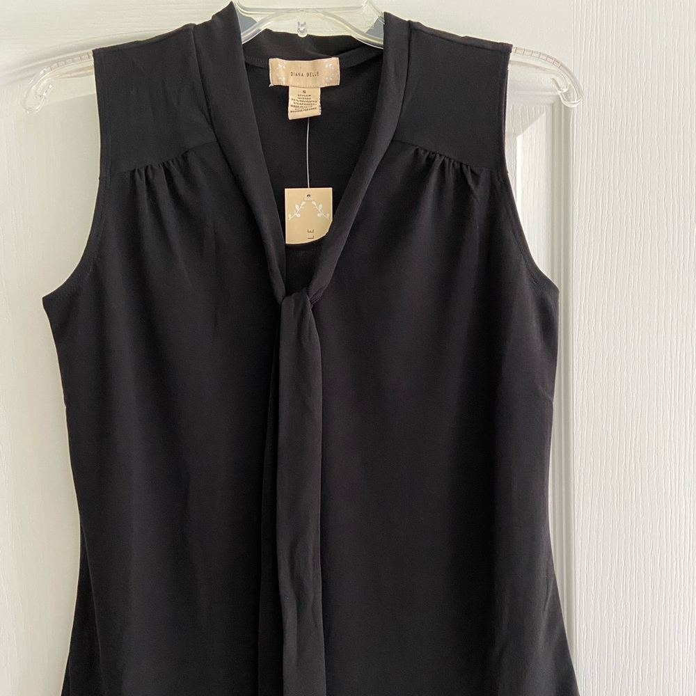 Brand new w tags. Blouse Size Small